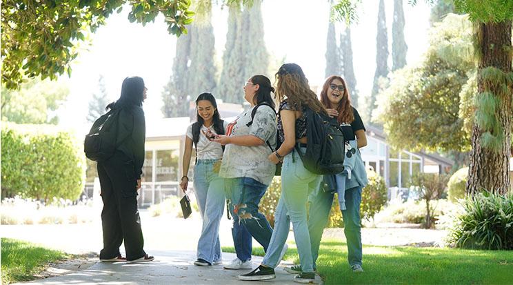 Photo of a group of students laughing together.